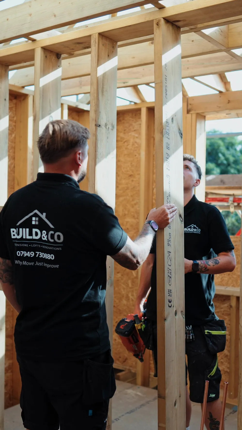 Two Build and Co carpenters on the frame